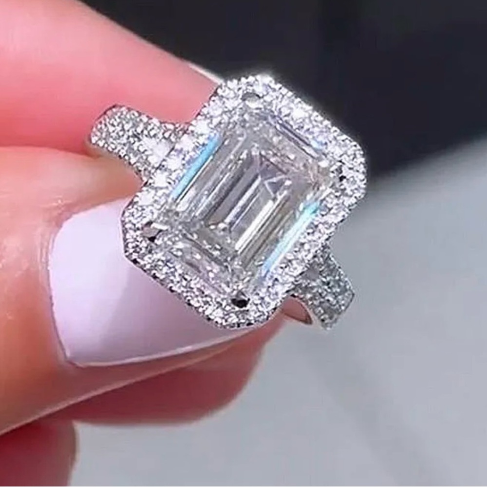 Luxury Halo Split Shank Emerald Cut Engagement Ring In Sterling Silver
